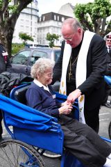 2011 Lourdes Pilgrimage - Archbishop Dolan with Malades (261/267)